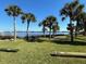 Inviting community waterfront features including palm trees, picnic area, and beautiful views of the water at 1146 Riverside Dr, Daytona Beach, FL 32117