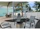 Inviting outdoor patio area with fire pit, dining, grill, and covered seating, perfect for entertaining at 1146 Riverside Dr, Daytona Beach, FL 32117