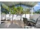 Covered patio featuring an outdoor dining area with a table and chairs for relaxing and entertaining at 1146 Riverside Dr, Daytona Beach, FL 32117