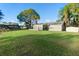 Spacious backyard offering a tranquil view of the water at 2573 Delaware Rd, Deltona, FL 32738