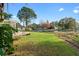 Peaceful backyard with a view of the lake and lush lawn at 2573 Delaware Rd, Deltona, FL 32738
