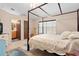 Spacious bedroom with a four-poster bed and ensuite bathroom at 2573 Delaware Rd, Deltona, FL 32738