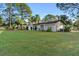 Single-story home with a well-maintained lawn and driveway at 2573 Delaware Rd, Deltona, FL 32738