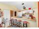 Bright kitchen features ample counter space and a breakfast bar with seating at 2573 Delaware Rd, Deltona, FL 32738