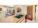 Galley kitchen with double sink and built-in microwave at 2573 Delaware Rd, Deltona, FL 32738