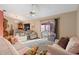 Relaxing living room featuring comfy sofas and a view to the patio at 2573 Delaware Rd, Deltona, FL 32738