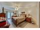 Spacious bedroom with wood furnishings and access to a patio at 404 S Beach St # 010 101, Daytona Beach, FL 32114