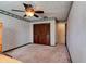 Bedroom with wood closet doors and ceiling fan at 453 Merrimac Dr, Port Orange, FL 32127
