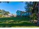 Back of light blue house, spacious yard at 453 Merrimac Dr, Port Orange, FL 32127