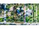 Aerial view of property and pool, outlined in red, showcasing a well-maintained yard at 5178 Riverside Dr, Port Orange, FL 32127