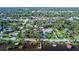 Aerial view with red outline of a home, lot, and waterfront parcel at 5178 Riverside Dr, Port Orange, FL 32127