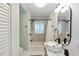 Bathroom with tile flooring, shower-tub combo, and modern sink at 5178 Riverside Dr, Port Orange, FL 32127