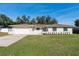 Charming single-story home boasting a manicured lawn, garage, and an inviting front entrance at 7360 Canal Dr, Sanford, FL 32771