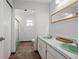 Bathroom with dual sinks and a separate shower and tub at 1275 Elkcam Blvd, Deltona, FL 32725