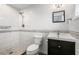 Updated bathroom with walk-in shower, toilet, and modern vanity at 1275 Elkcam Blvd, Deltona, FL 32725