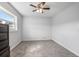Bright bedroom with carpeted floor and ceiling fan at 1275 Elkcam Blvd, Deltona, FL 32725