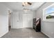 Well-lit bedroom featuring carpeted floors and a dresser at 1275 Elkcam Blvd, Deltona, FL 32725