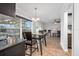 Bright dining room with glass-top table and access to the kitchen at 1275 Elkcam Blvd, Deltona, FL 32725