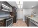 Updated kitchen with stainless steel appliances and granite countertops at 1275 Elkcam Blvd, Deltona, FL 32725