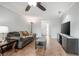 Cozy living room featuring a comfy sofa and large TV at 1275 Elkcam Blvd, Deltona, FL 32725
