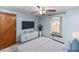 Relaxing bedroom with a large TV and plenty of natural light at 1391 San Carlos Ave, Deltona, FL 32738