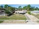 Charming single-story home featuring a well-maintained lawn, screened porch, and long driveway at 1391 San Carlos Ave, Deltona, FL 32738