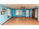 Spacious living room with tile floors and light blue walls at 1391 San Carlos Ave, Deltona, FL 32738