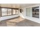 Cozy screened porch with carpet flooring, ideal for relaxing at 1391 San Carlos Ave, Deltona, FL 32738