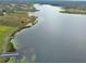 Aerial view of lakefront property with expansive water views at 180 Robinson Ln, Seville, FL 32190