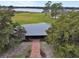 Aerial view of a home with a metal roof and brick pathway at 180 Robinson Ln, Seville, FL 32190