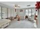 Bright bedroom with window coverings and a cozy sitting area at 180 Robinson Ln, Seville, FL 32190