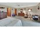 Serene bedroom with a queen-size bed and ample closet space at 180 Robinson Ln, Seville, FL 32190