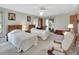 Bright bedroom with twin beds, and a ceiling fan at 180 Robinson Ln, Seville, FL 32190