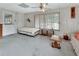 Small bedroom with a double bed and adjacent living area at 180 Robinson Ln, Seville, FL 32190