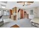 Simple bedroom with a bed, dresser, and access to living area at 180 Robinson Ln, Seville, FL 32190