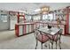 Bright kitchen features red and white cabinets, an island, and a dining area at 180 Robinson Ln, Seville, FL 32190