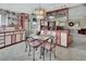 Kitchen with red and white cabinets, a built-in hutch, and a small table at 180 Robinson Ln, Seville, FL 32190