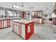 Red and white kitchen with an island and a view into the living room at 180 Robinson Ln, Seville, FL 32190