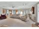 Spacious living room featuring comfortable seating and ample natural light at 180 Robinson Ln, Seville, FL 32190