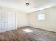 Spacious bedroom featuring wood-look floors and a double-door closet at 2129 Lime Tree Dr, Edgewater, FL 32141