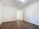 Bright bedroom with wood-look floors and access to a hallway at 2129 Lime Tree Dr, Edgewater, FL 32141