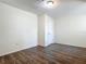 Bright bedroom with wood-look floors and ample closet space at 2129 Lime Tree Dr, Edgewater, FL 32141