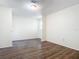 Simple bedroom with wood-look floors and ample closet space at 2129 Lime Tree Dr, Edgewater, FL 32141