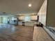 Modern kitchen featuring white cabinets, granite countertops, and stainless steel appliances at 2129 Lime Tree Dr, Edgewater, FL 32141