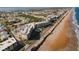 Aerial view of oceanfront building, road, and beach at 2700 Ocean Shore Blvd # 317, Ormond Beach, FL 32176