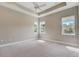 Spacious and airy bedroom featuring a tray ceiling and large windows that provide plenty of natural light at 430 Cypress Hills Way, Deland, FL 32724