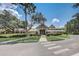 Exterior view of community clubhouse with lush landscaping and inviting entrance at 430 Cypress Hills Way, Deland, FL 32724