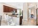 A lovely kitchen with an island bar, stainless steel appliances, and beautiful countertops with backsplash at 430 Cypress Hills Way, Deland, FL 32724