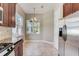 The kitchen breakfast nook is lit by natural light from a window and features stainless steel appliances at 430 Cypress Hills Way, Deland, FL 32724