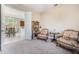 Cozy office space features comfortable seating, a bookshelf, and easy access to the kitchen at 430 Cypress Hills Way, Deland, FL 32724